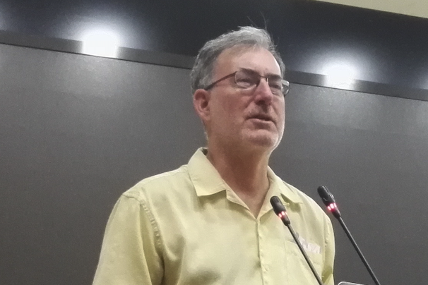 Keith Johnson at a lecture podium, cropped