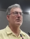 Keith Johnson at a lecture podium, cropped