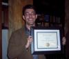 Lev Michael with Distinguished Teaching Award certificate